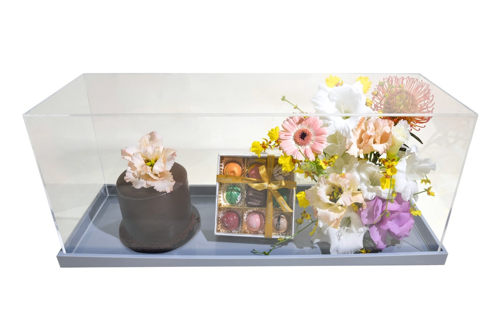 Dark brown cake with Premium Flowers Delivery UAE- The Botanical Lounge