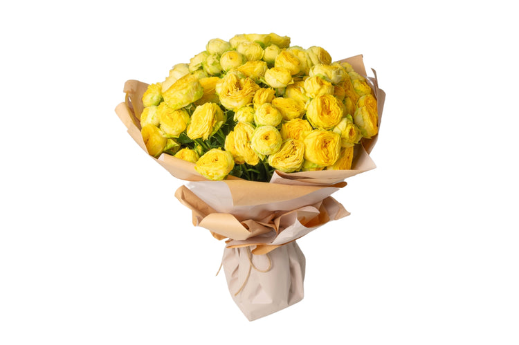 A bunch of yellow roses tied together, presented as a bouquet.