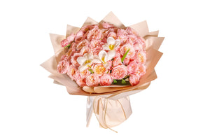 A bouquet of pink and white flowers, wrapped in brown paper with a ribbon.